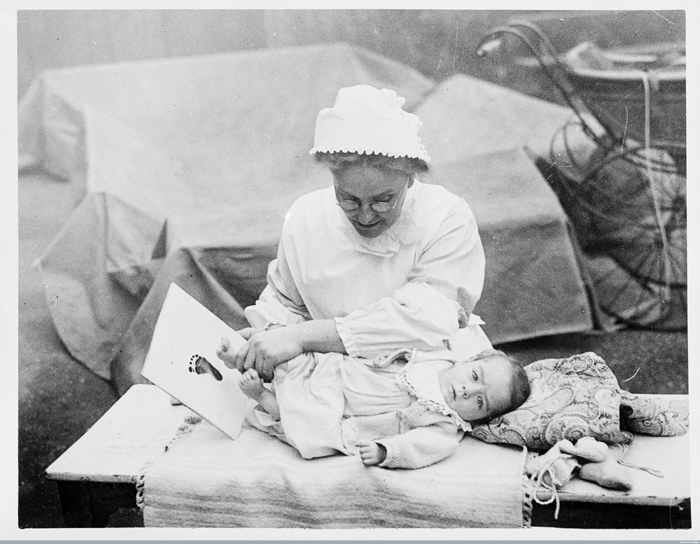 A baby's footprint being taken by a nurse for identification purposes. Photograph, 1910/1920 - Image courtesy of the Wellcome Library, London